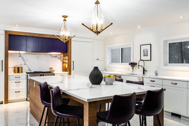 Expansive contemporary u-shaped kitchen/diner in Montreal with engineered stone countertops, white splashback, stone slab splashback, integrated appliances, porcelain flooring, an island, white floors, white worktops, a submerged sink, recessed-panel cabinets and purple cabinets.