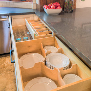 This is an example of a mid-sized country u-shaped open plan kitchen in San Diego with an undermount sink, recessed-panel cabinets, white cabinets, quartzite benchtops, white splashback, subway tile splashback, stainless steel appliances, travertine floors, with island and beige floor.