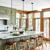 Distressed Green Cabinets Bring Weathered Charm to a New Kitchen