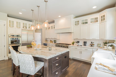 Mid-sized transitional l-shaped dark wood floor open concept kitchen photo in Wilmington with a farmhouse sink, shaker cabinets, white cabinets, marble countertops and an island