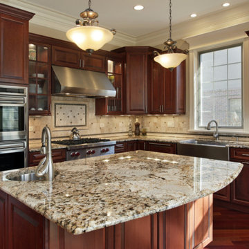 Delicatus Gold granite countertop with travertine back splashes