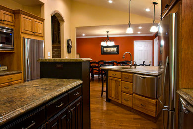 Eat-in kitchen - mid-sized transitional galley medium tone wood floor eat-in kitchen idea in Salt Lake City with an integrated sink, raised-panel cabinets, medium tone wood cabinets, concrete countertops, multicolored backsplash, cement tile backsplash, stainless steel appliances and an island