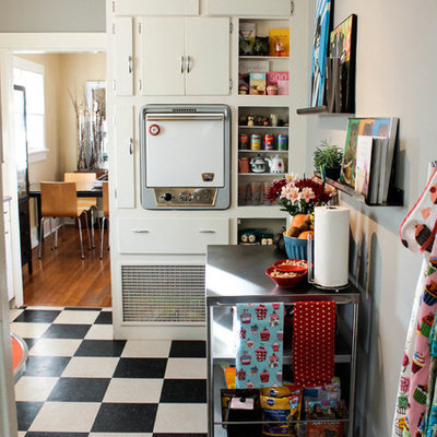 Eclectic multicolored floor kitchen photo in Denver with flat-panel cabinets, white cabinets and white appliances