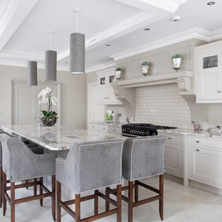 Inspiration for a large transitional open plan kitchen in Other with an integrated sink, beaded inset cabinets, grey cabinets, granite benchtops, beige splashback, subway tile splashback, panelled appliances, ceramic floors and with island.