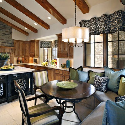 Elegant eat-in kitchen photo in Phoenix with medium tone wood cabinets