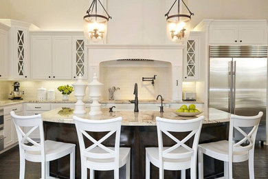 Example of a large transitional l-shaped medium tone wood floor eat-in kitchen design in Dallas with a farmhouse sink, glass-front cabinets, white cabinets, laminate countertops, white backsplash, ceramic backsplash, stainless steel appliances and an island