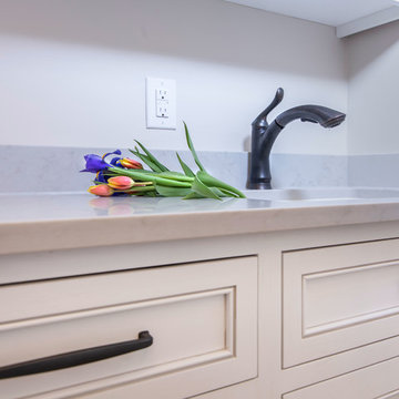 Designer white laundry room - inset cabinets - wash sink