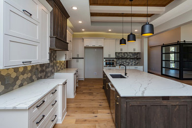 Inspiration for a huge transitional l-shaped medium tone wood floor and brown floor open concept kitchen remodel in Other with an undermount sink, shaker cabinets, white cabinets, marble countertops, multicolored backsplash, porcelain backsplash, stainless steel appliances, an island and white countertops