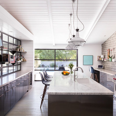 Inspiration for a large mid-century modern galley kitchen remodel in Los Angeles with an undermount sink, flat-panel cabinets, gray cabinets, multicolored backsplash, stainless steel appliances and an island
