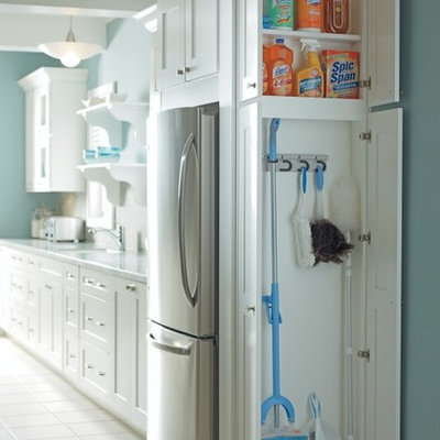 Small elegant ceramic tile kitchen photo in Other with white cabinets
