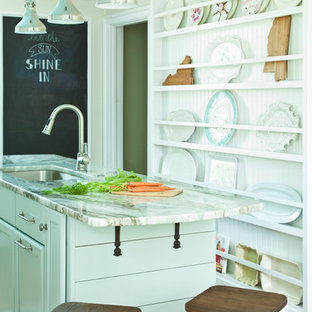 Kitchen ideas - Medium tone wood floor kitchen photo in Richmond with granite countertops, white backsplash, subway tile backsplash, paneled appliances and an island