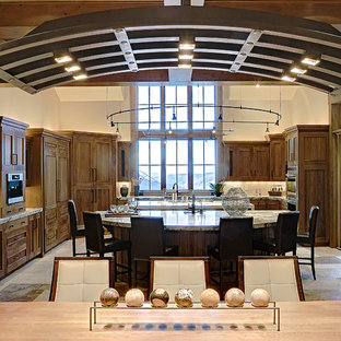 Transitional eat-in kitchen remodeling - Transitional u-shaped eat-in kitchen photo in Salt Lake City with medium tone wood cabinets and white backsplash