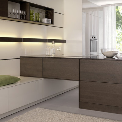 Inspiration for a modern open concept kitchen remodel in Boston with flat-panel cabinets, white cabinets and stainless steel appliances