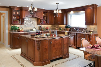 Eat-in kitchen - traditional l-shaped vinyl floor eat-in kitchen idea in New York with an undermount sink, beaded inset cabinets, medium tone wood cabinets, granite countertops, beige backsplash, porcelain backsplash, paneled appliances and an island