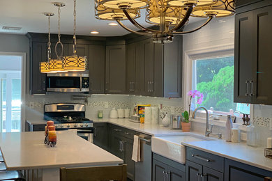 Inspiration for a large cottage l-shaped eat-in kitchen remodel in New York with shaker cabinets, gray cabinets, quartzite countertops, an island and white countertops