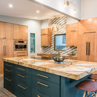 This is an example of a mid-sized midcentury l-shaped eat-in kitchen in Detroit with a single-bowl sink, flat-panel cabinets, medium wood cabinets, quartzite benchtops, multi-coloured splashback, ceramic splashback, slate floors, with island, multi-coloured floor and panelled appliances.