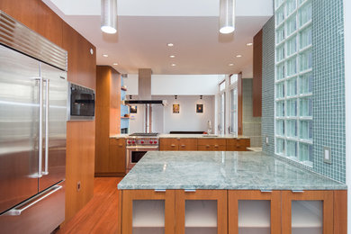 Open concept kitchen - large contemporary u-shaped dark wood floor and brown floor open concept kitchen idea in DC Metro with an undermount sink, flat-panel cabinets, medium tone wood cabinets, granite countertops, blue backsplash, mosaic tile backsplash, stainless steel appliances and an island