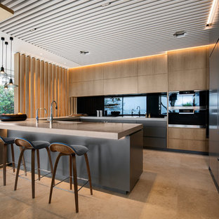 Inspiration for a large contemporary u-shaped eat-in kitchen in Sydney with flat-panel cabinets, brown benchtop, an undermount sink, medium wood cabinets, black splashback, glass sheet splashback, panelled appliances, a peninsula and beige floor.