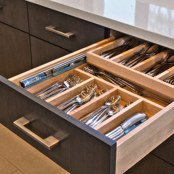 Double tiered cutlery divider for maximum drawer storage.