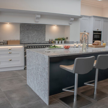 Dove grey kitchen with granite surfaces in Victorian townhouse