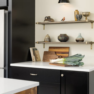 Inspiration for a large u-shaped open plan kitchen in DC Metro with a drop-in sink, shaker cabinets, black cabinets, quartz benchtops, white splashback, porcelain splashback, black appliances, porcelain floors, a peninsula, multi-coloured floor and white benchtop.
