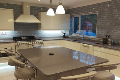 Design ideas for a large contemporary l-shaped kitchen/diner in West Midlands with an island.