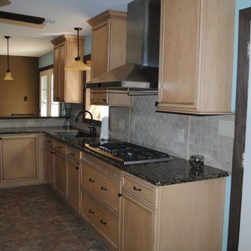 Duraceramic Floors, Maple Cabinets, Baltic Brown Granite with Tile Backsplash