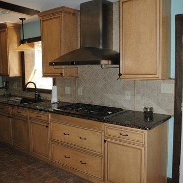 Duraceramic Floors, Maple Cabinets, Baltic Brown Granite with Tile Backsplash