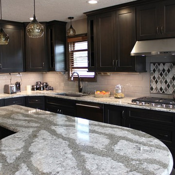 DuraSupreme Peppercorn Kitchen With Cambria Tops and Black Stainless Appliances