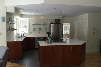 Inspiration for a small contemporary l-shaped eat-in kitchen remodel in Boston with shaker cabinets, medium tone wood cabinets, quartz countertops, stainless steel appliances and an island
