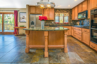 Eat-in kitchen - mid-sized craftsman l-shaped marble floor eat-in kitchen idea in Sacramento with a double-bowl sink, recessed-panel cabinets, light wood cabinets, granite countertops, multicolored backsplash, stone tile backsplash, stainless steel appliances and an island