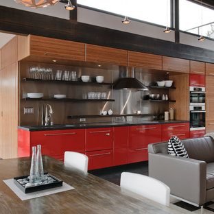 Industrial open concept kitchen inspiration - Urban single-wall open concept kitchen photo in Seattle with open cabinets, red cabinets, metallic backsplash, metal backsplash and paneled appliances