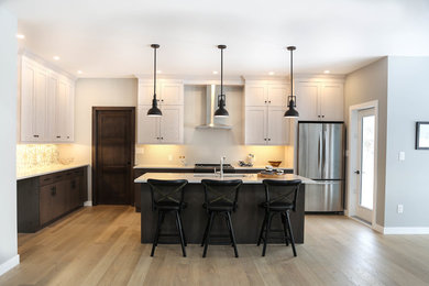 Inspiration for a mid-sized transitional l-shaped light wood floor and brown floor eat-in kitchen remodel in Other with an undermount sink, shaker cabinets, quartz countertops, white backsplash, porcelain backsplash, stainless steel appliances, an island and white countertops