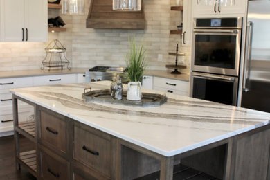 Large transitional u-shaped kitchen photo in Other with shaker cabinets, quartzite countertops, an island and white countertops