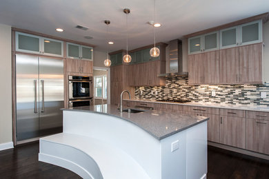 Kitchen - large contemporary l-shaped dark wood floor and brown floor kitchen idea in New York with an undermount sink, flat-panel cabinets, light wood cabinets, multicolored backsplash, stainless steel appliances and an island