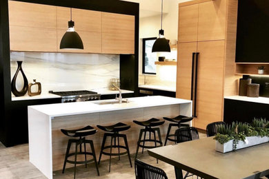 Inspiration for a modern kitchen remodel in Boise with flat-panel cabinets and porcelain backsplash