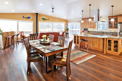 Example of a large transitional single-wall vinyl floor and red floor open concept kitchen design in Other with an undermount sink, shaker cabinets, medium tone wood cabinets, quartz countertops, brown backsplash, quartz backsplash, stainless steel appliances, an island and brown countertops