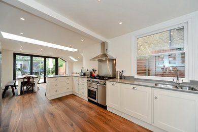 Photo of a contemporary grey and cream kitchen in London.