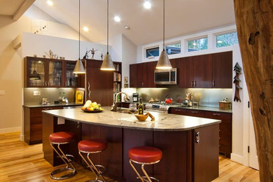 Example of a mid-sized trendy light wood floor kitchen design in Other with an island