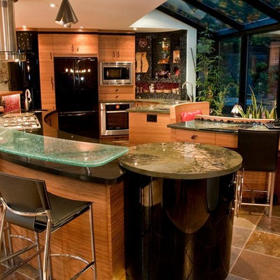 Inspiration for a contemporary u-shaped open concept kitchen remodel in Toronto with flat-panel cabinets, light wood cabinets and black appliances