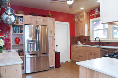 Example of a mid-sized eclectic u-shaped beige floor and cork floor enclosed kitchen design in Portland with a double-bowl sink, red backsplash, stainless steel appliances, shaker cabinets, light wood cabinets, marble countertops, porcelain backsplash and a peninsula