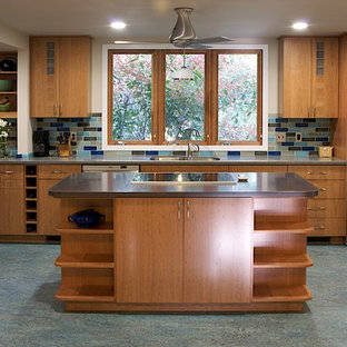 Inspiration for a traditional eat-in kitchen in DC Metro with an undermount sink, flat-panel cabinets, medium wood cabinets, multi-coloured splashback, stainless steel appliances and turquoise floor.