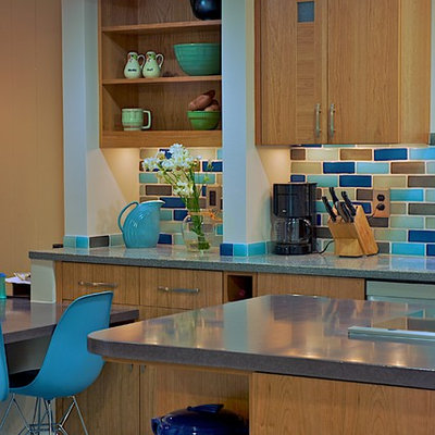 Kitchen - traditional kitchen idea in DC Metro with concrete countertops, multicolored backsplash, flat-panel cabinets, medium tone wood cabinets and subway tile backsplash