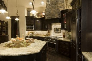 Example of a mountain style kitchen design in Denver with an island