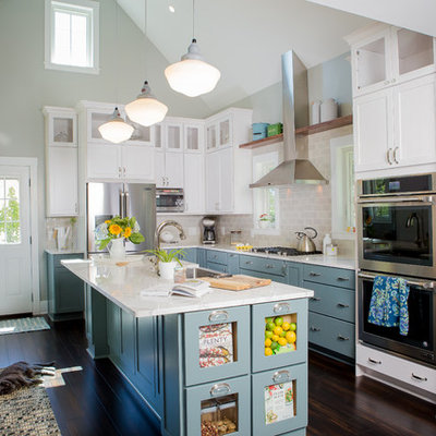 Kitchen - large traditional u-shaped brown floor and bamboo floor kitchen idea in Other with shaker cabinets, white cabinets, subway tile backsplash, stainless steel appliances, an island, a farmhouse sink, quartzite countertops and gray backsplash