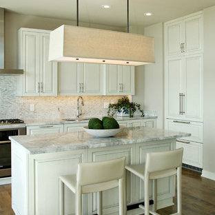 Contemporary kitchen designs - Inspiration for a contemporary kitchen remodel in Minneapolis with paneled appliances and gray countertops