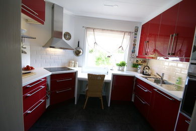 Inspiration for a small contemporary u-shaped enclosed kitchen in Other with a double-bowl sink, flat-panel cabinets, red cabinets, laminate countertops, white splashback, ceramic splashback, stainless steel appliances and no island.