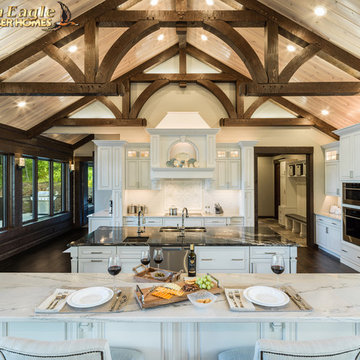 Elegant Gourmet kitchen, with two islands painted white cabinets