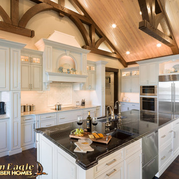 Elegant Gourmet kitchen, with two islands painted white cabinets