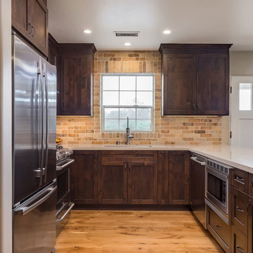 Elegant Medium Hardwood Floors in Contemporary Kitchen